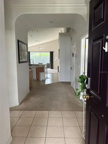 a lobby with furniture and a potted plant