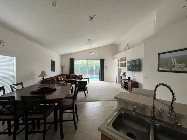 a view of a dining room with furniture and window
