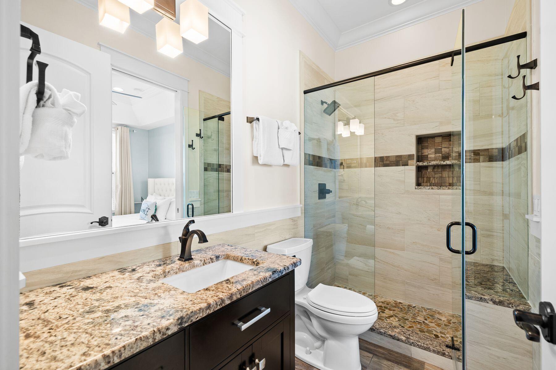 52 Le Soleil Drive Miramar Beach, FL 32550 - Photo 13 of 31 a bathroom with a granite countertop sink toilet and shower