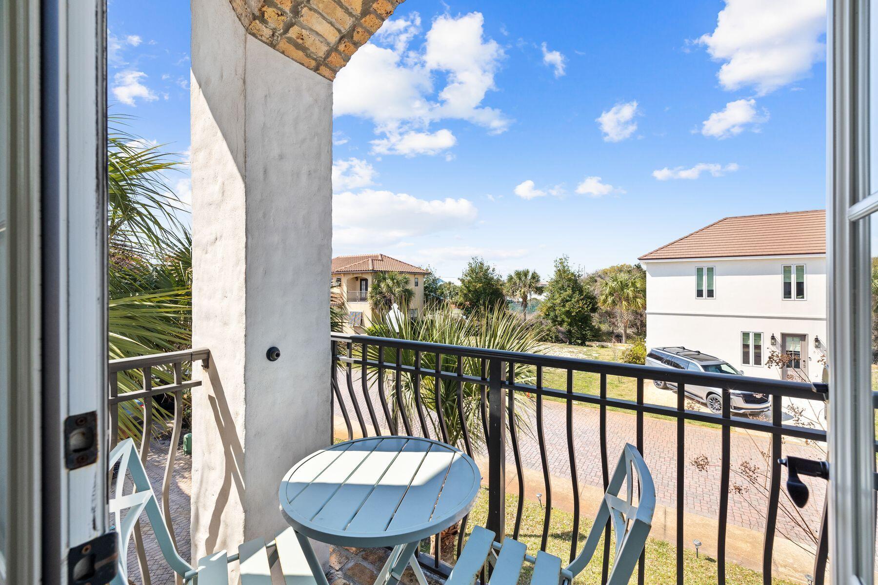 52 Le Soleil Drive Miramar Beach, FL 32550 - Photo 22 of 31 a balcony with a table and chairs