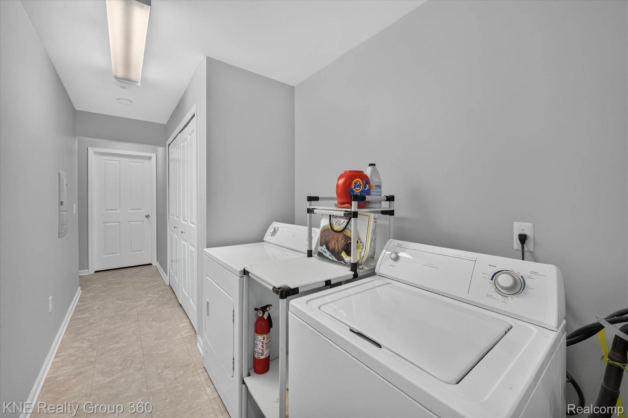 4077 Berkeley Avenue Canton, MI 48188 - Photo 25 of 32 Dedicated laundry area featuring tile flooring, neutral wall tones, and overhead lighting