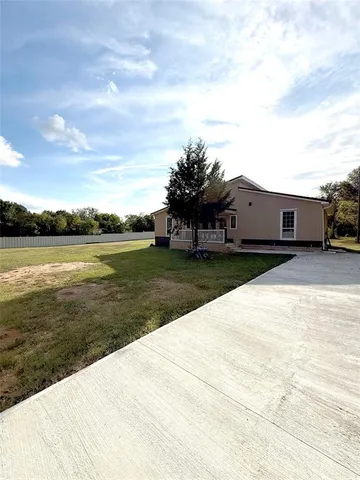 a view of a lake with a big yard