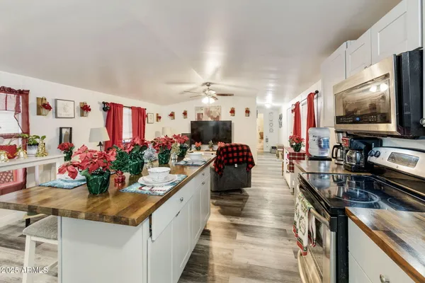 a kitchen with stove and flowers