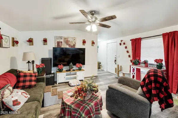 a living room with furniture and a flat screen tv