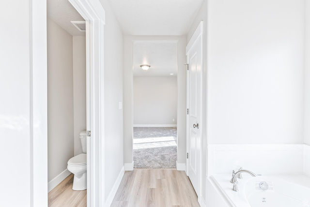 257 North Slant Road, Unit 51M Mapleton, UT 84660 - Photo 18 of 24 Bathroom with light wood-style floors and a bath