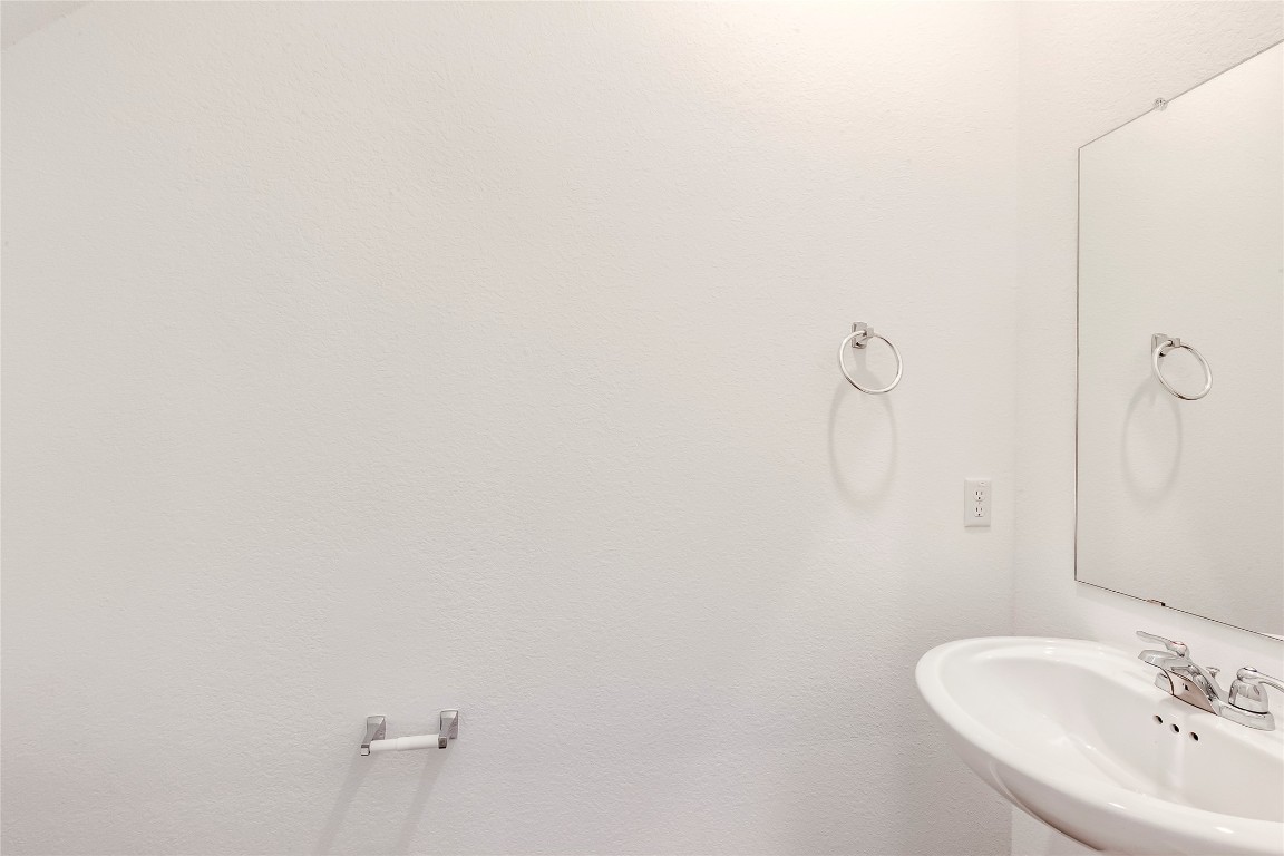 2113 Guntersville Bend Leander, TX 78641 - Photo 18 of 40 a bathroom with a sink and mirror