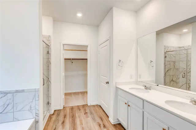 a bathroom with a bathtub and shower
