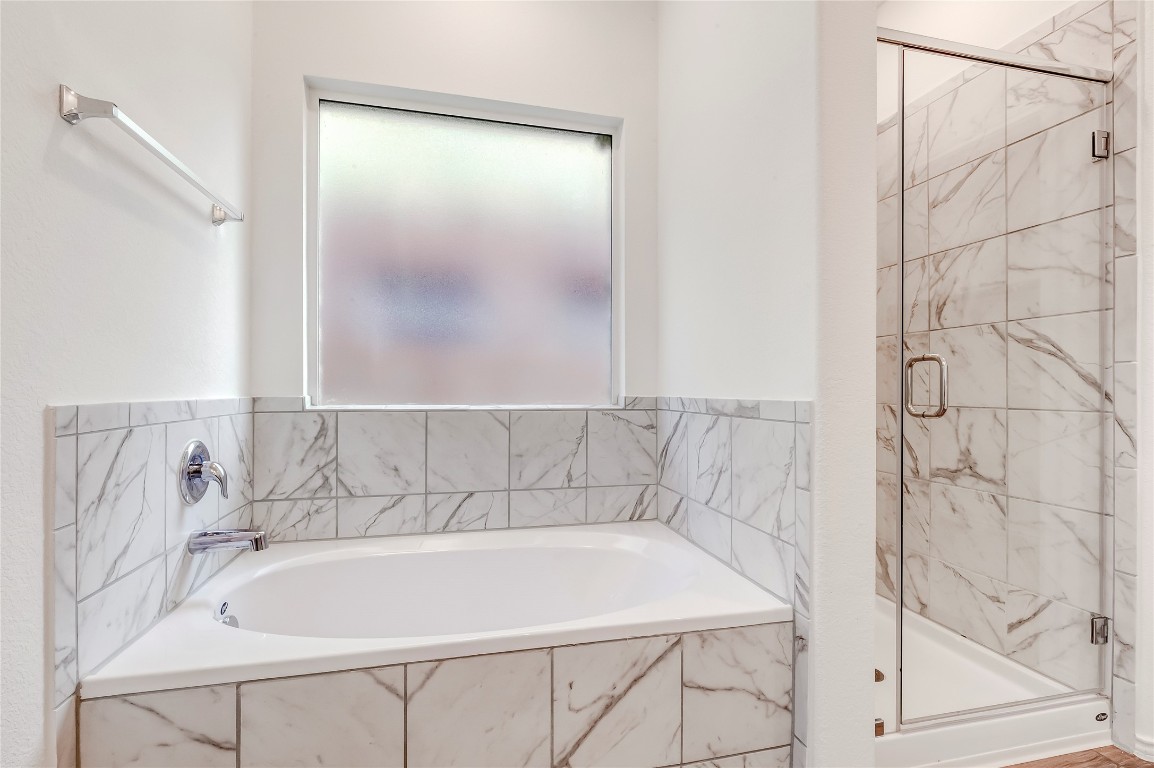 2113 Guntersville Bend Leander, TX 78641 - Photo 22 of 40 a bathroom with a bathtub and shower