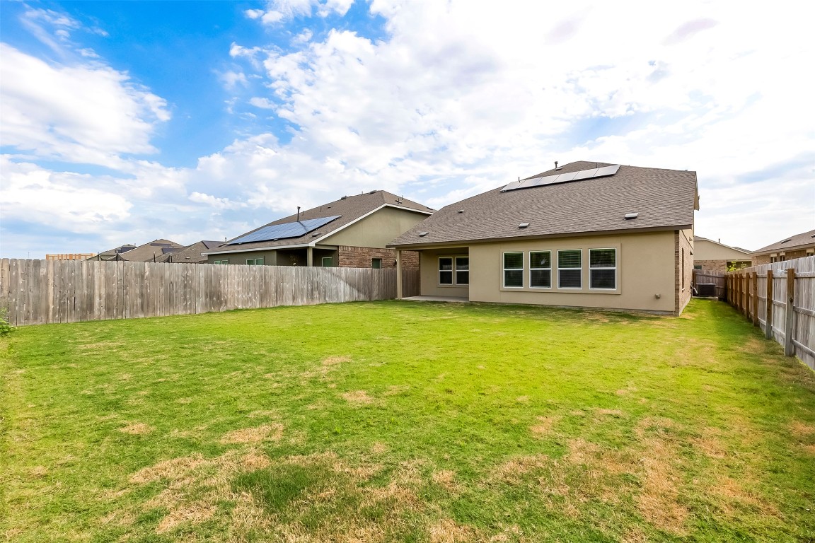 2113 Guntersville Bend Leander, TX 78641 - Photo 35 of 40 a front view of a house with a garden