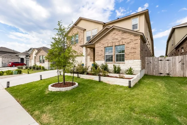 front view of a house with a yard