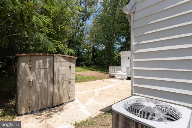 a view of a white house with a yard