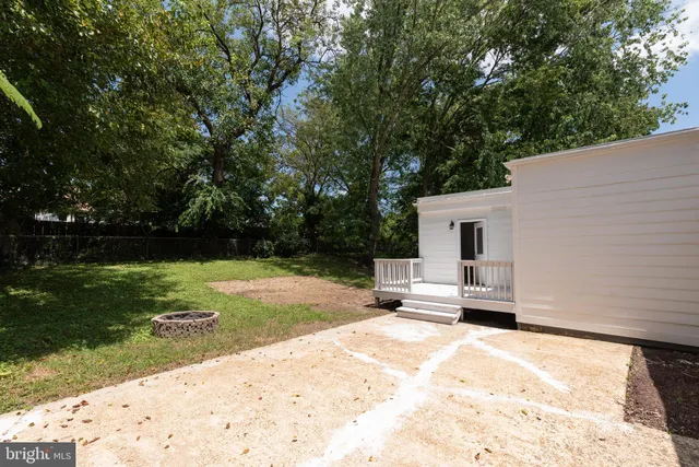 a house view with a sitting space and garden