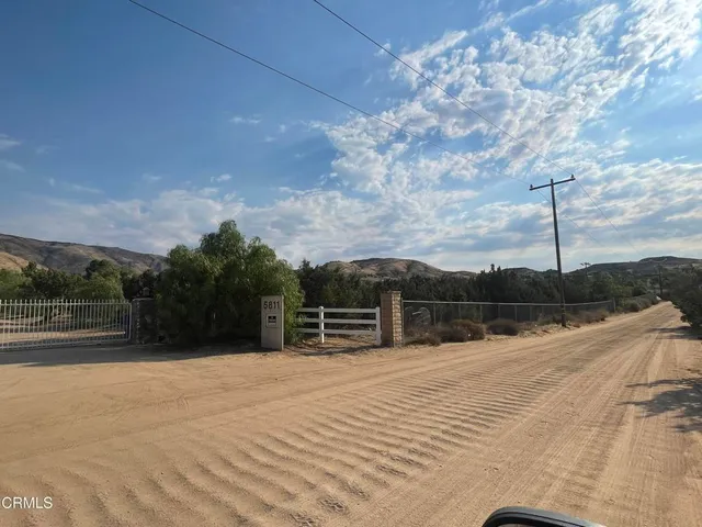 a view of a backyard with sitting area