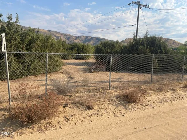 a view of a garage with cars
