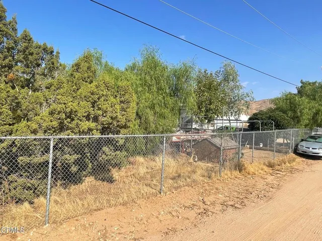a view of swimming pool with a yard and plants