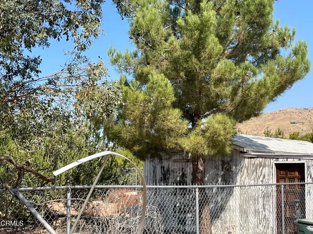 a view of a outdoor space with patio and fire pit
