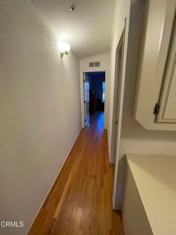 a view of living room with furniture and flat screen tv