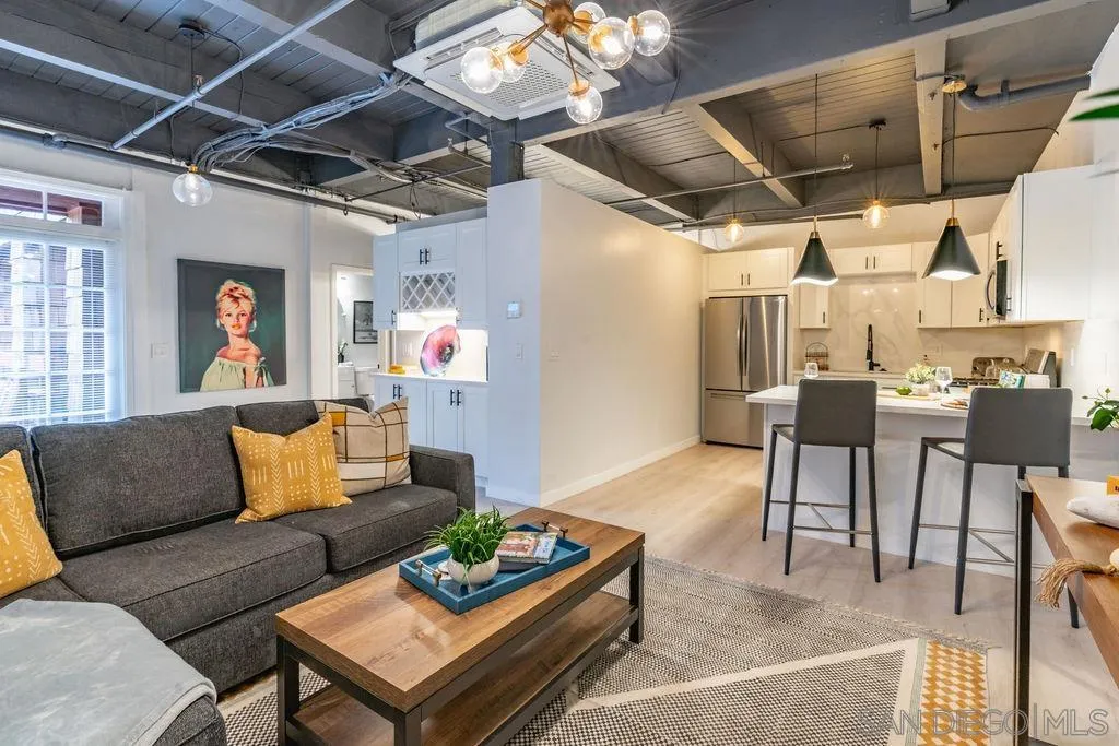 1298 Prospect Street, Unit 2F La Jolla, CA 92037 - Photo 10 of 54 a living room with furniture and a chandelier