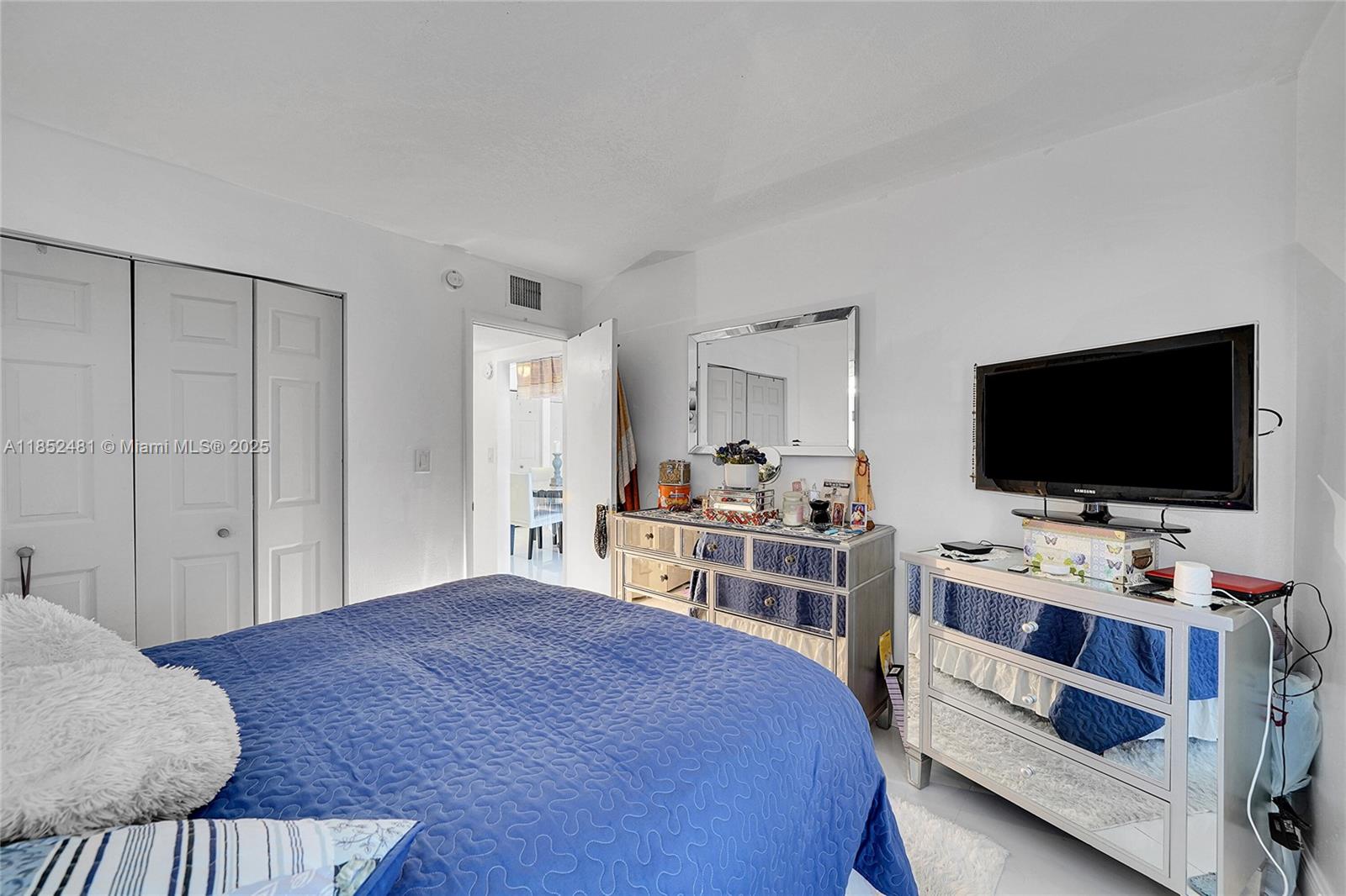 405 South Pine Island Road, Unit 403D Plantation, FL 33324 - Photo 11 of 20 a bedroom with a bed and a flat screen tv