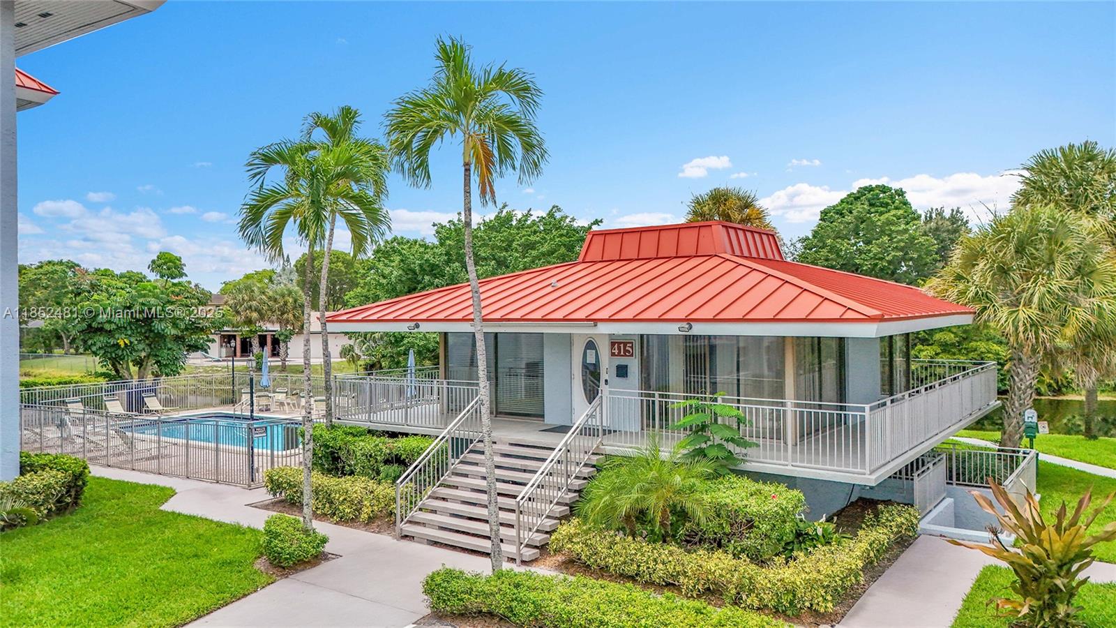 405 South Pine Island Road, Unit 403D Plantation, FL 33324 - Photo 15 of 20 a front view of a house with a garden