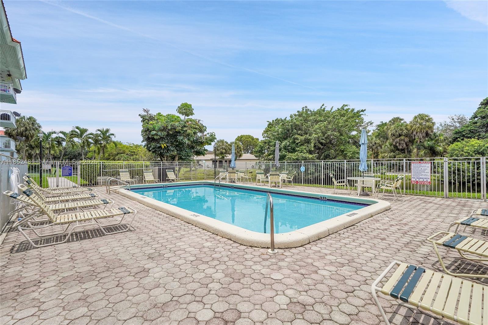405 South Pine Island Road, Unit 403D Plantation, FL 33324 - Photo 18 of 20 a view of a swimming pool with a lake