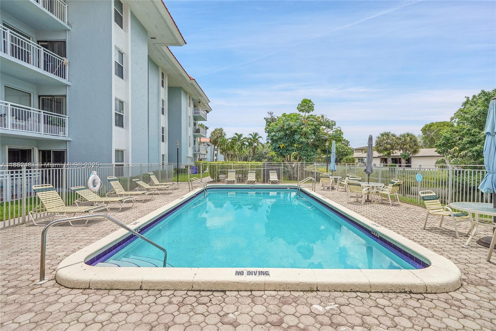 405 South Pine Island Road, Unit 403D Plantation, FL 33324 - Photo 20 of 20 a view of swimming pool with outdoor seating
