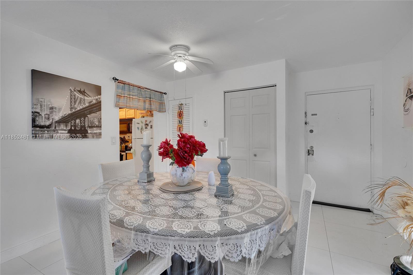 405 South Pine Island Road, Unit 403D Plantation, FL 33324 - Photo 4 of 20 a view of a dining room with furniture and chandelier