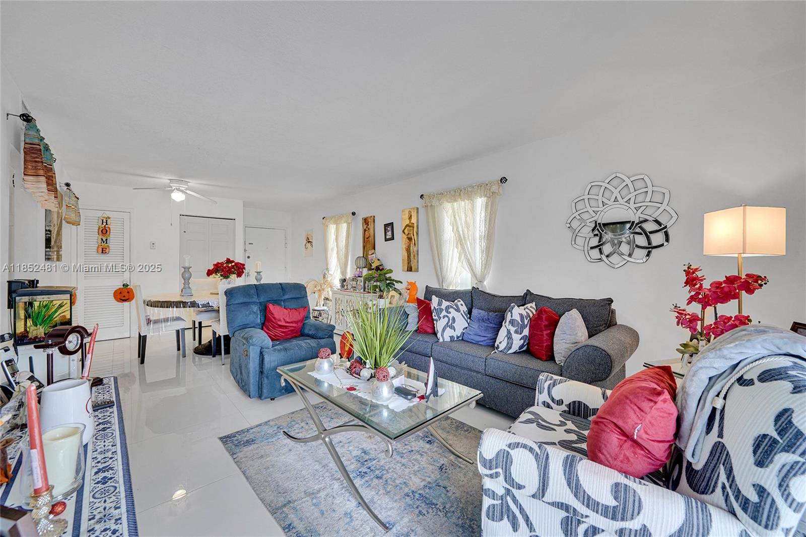 405 South Pine Island Road, Unit 403D Plantation, FL 33324 - Photo 6 of 20 a living room with furniture and a potted plant