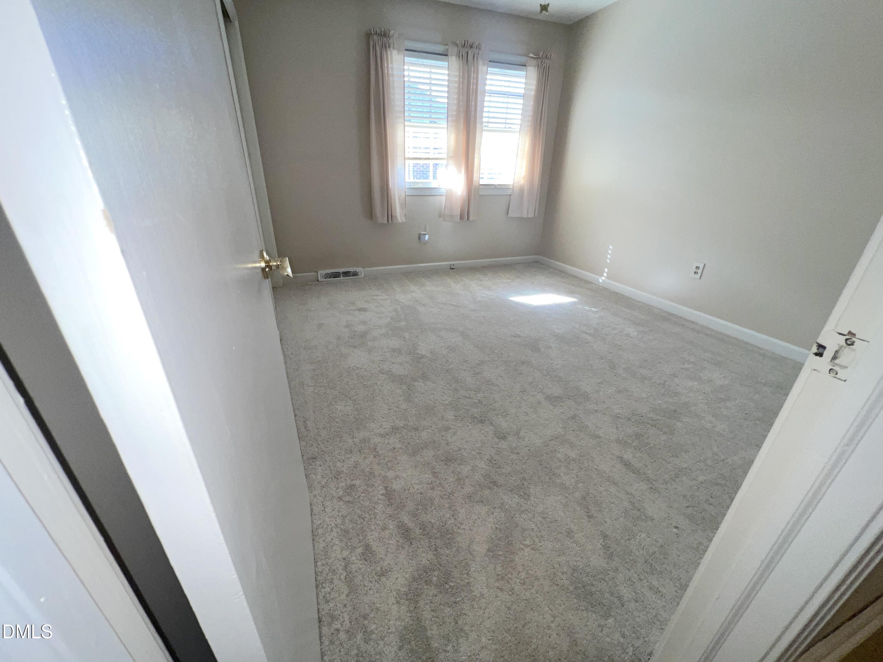 66 Allensville Road Roxboro, NC 27573 - Photo 23 of 52 a view of empty room with windows