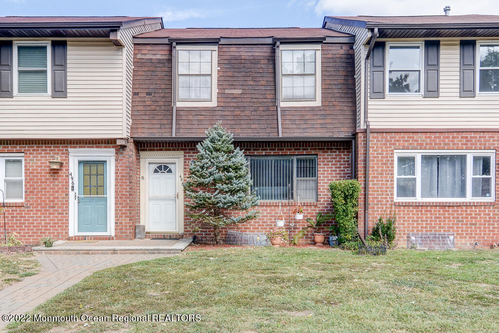 494 Rena Court Brick, NJ 08724 - Photo 1 of 18 a front view of a house with a yard and garage