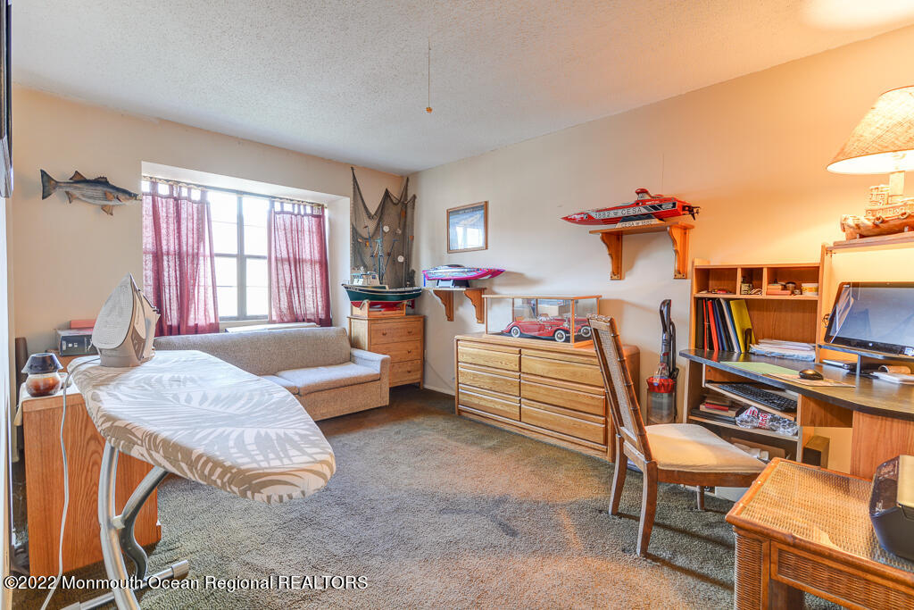 494 Rena Court Brick, NJ 08724 - Photo 14 of 18 a bedroom with furniture and a wooden floor