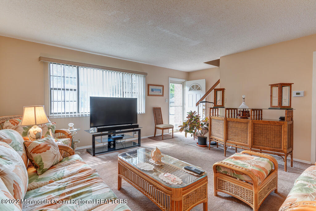 494 Rena Court Brick, NJ 08724 - Photo 3 of 18 a living room with furniture and a flat screen tv