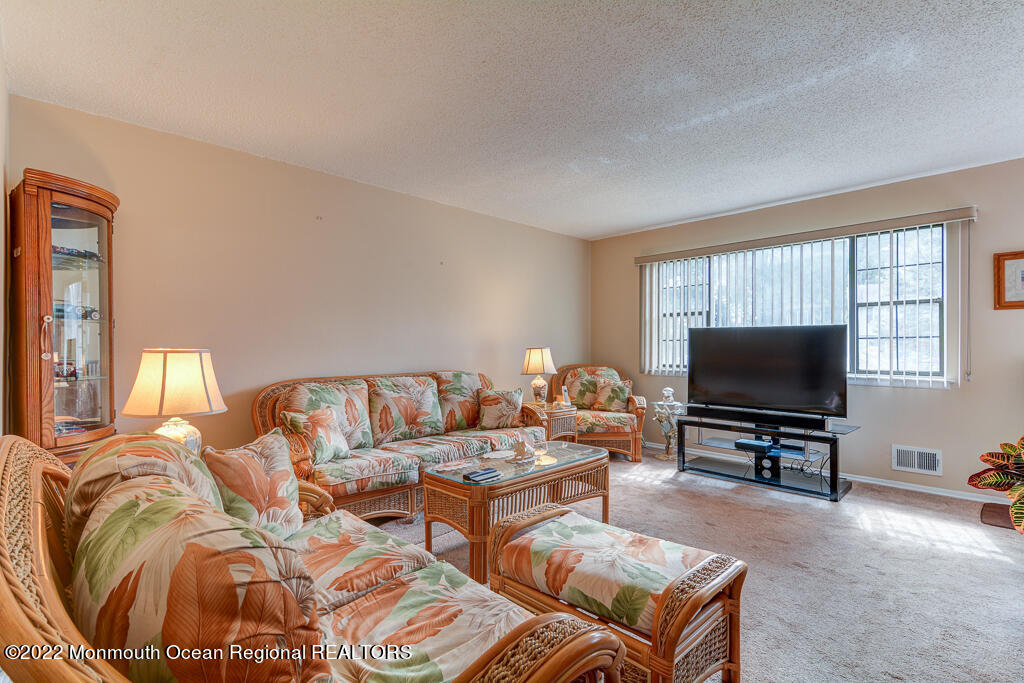 494 Rena Court Brick, NJ 08724 - Photo 4 of 18 a living room with furniture and a flat screen tv