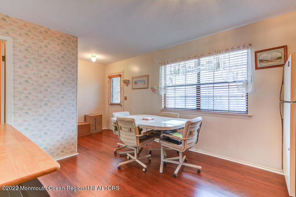 494 Rena Court Brick, NJ 08724 - Photo 8 of 18 a view of a dining room with furniture and wooden floor