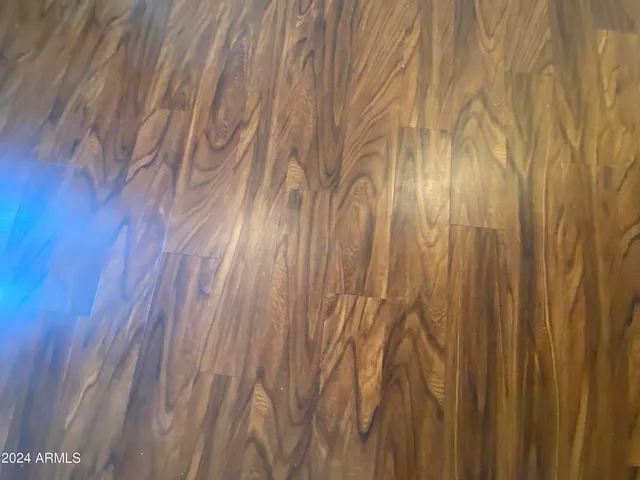 a bathroom with a white shower and a window of another room