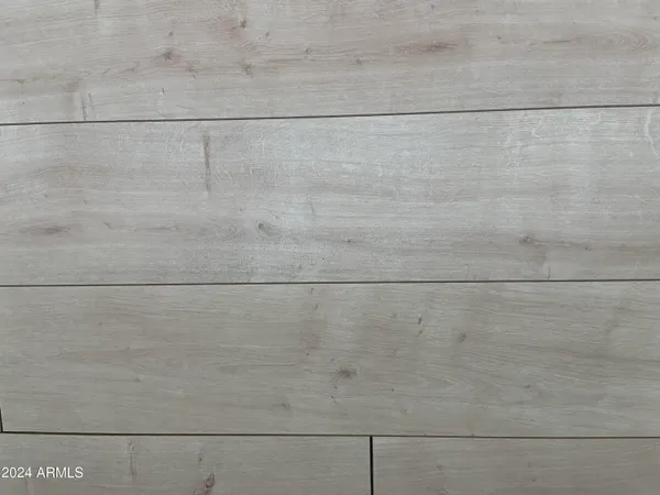 a bedroom with a bed and a mirror