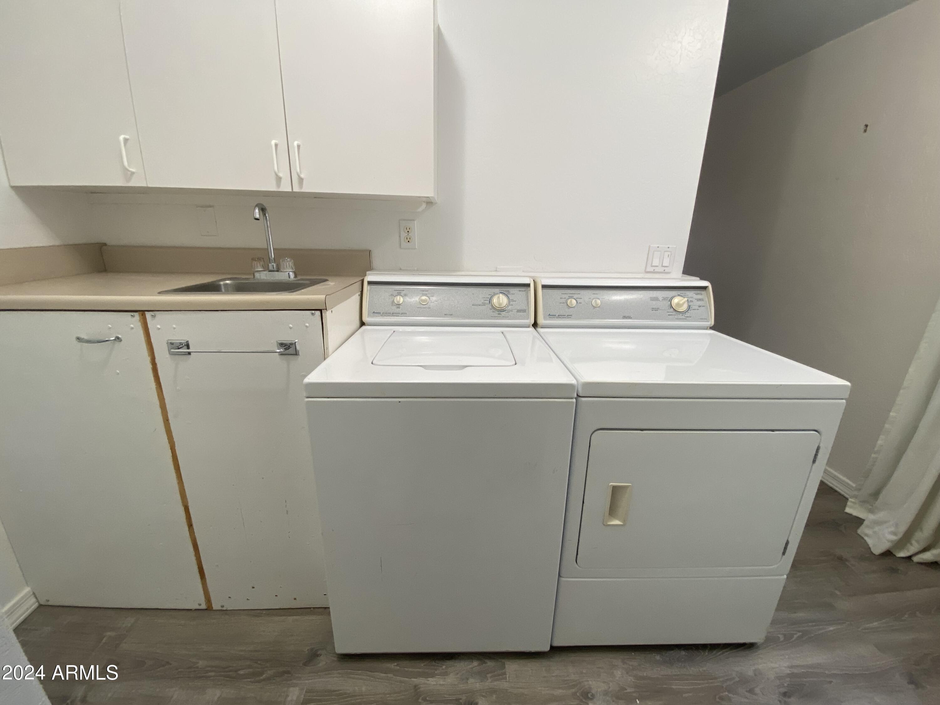2066 West Klamath Avenue, Unit 66 Apache Junction, AZ 85119 - Photo 18 of 35 a utility room with dryer and washer