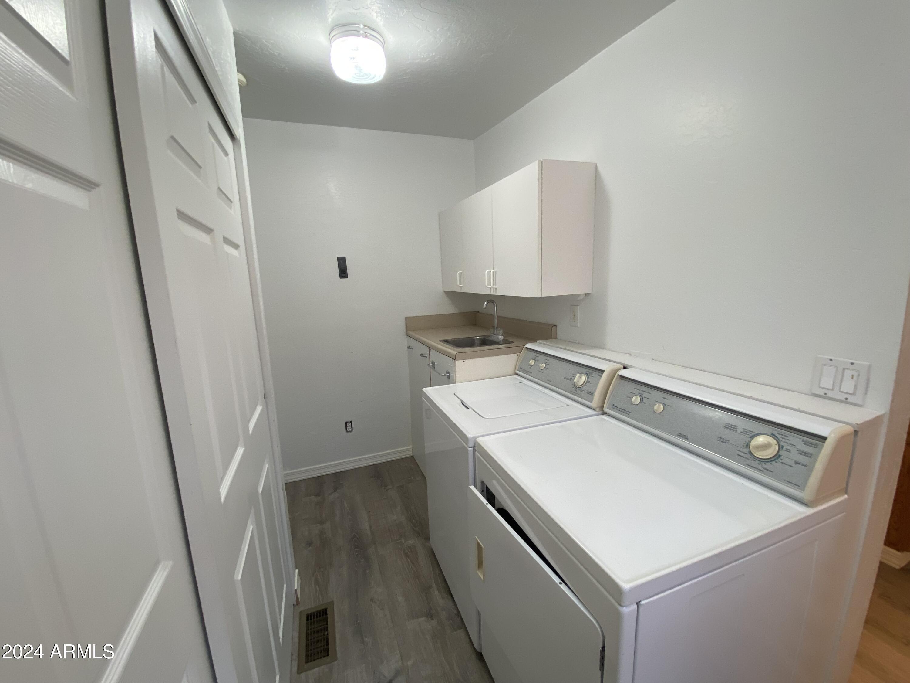 2066 West Klamath Avenue, Unit 66 Apache Junction, AZ 85119 - Photo 19 of 35 a utility room with dryer and washer