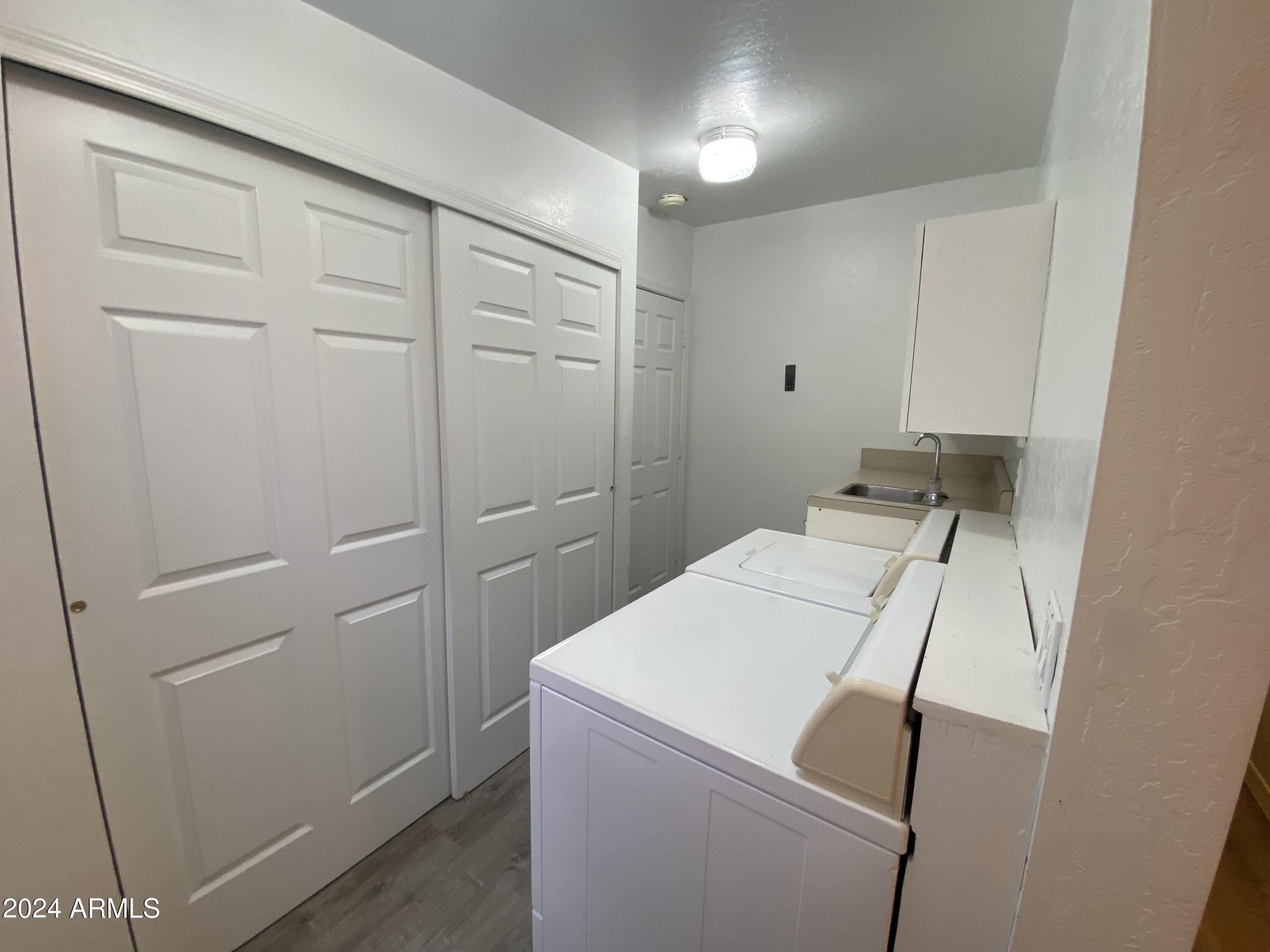 2066 West Klamath Avenue, Unit 66 Apache Junction, AZ 85119 - Photo 20 of 35 a utility room with dryer and washer