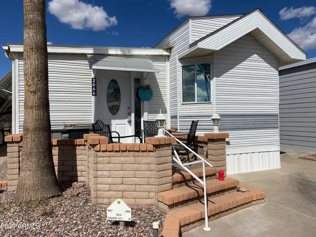 a front view of a house with parking