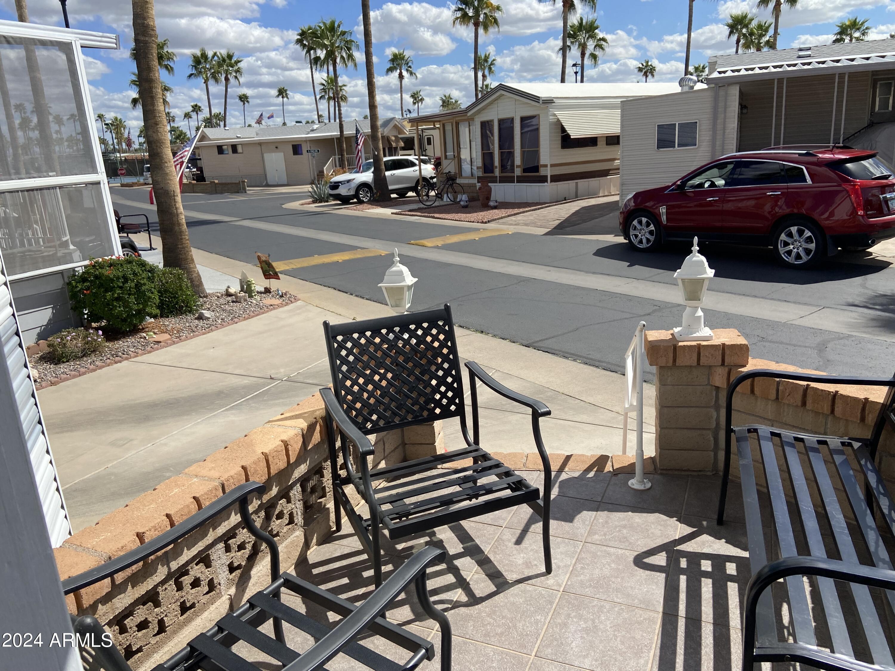2066 West Klamath Avenue, Unit 66 Apache Junction, AZ 85119 - Photo 29 of 35 a view of a city street with cars