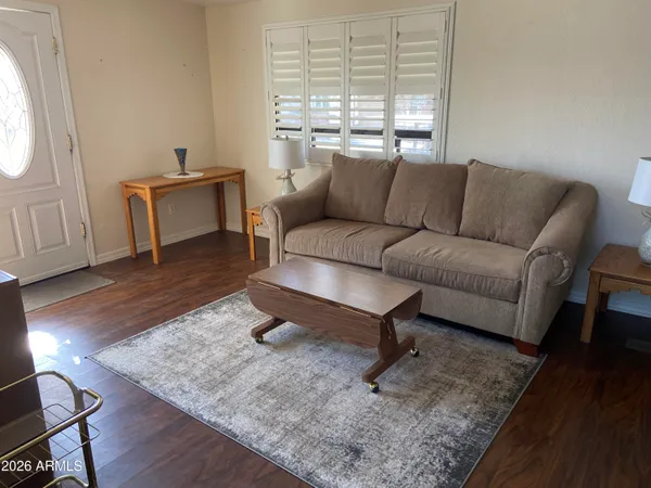 a living room with furniture and a window
