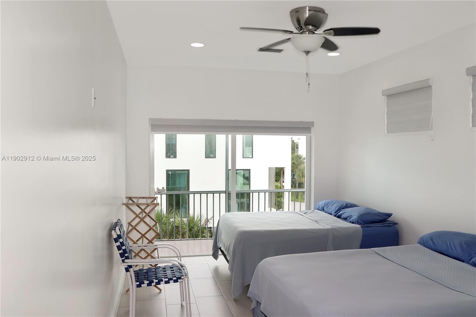 94825 Overseas Highway, Unit 172 Key Largo, FL 33037 - Photo 14 of 40 a bedroom with a bed and a window