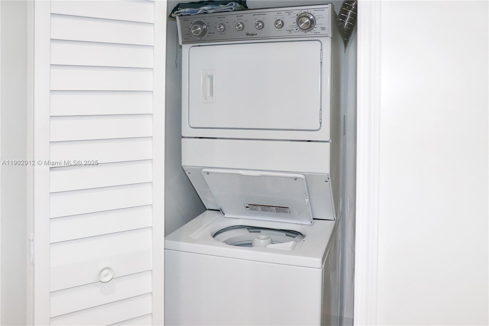 94825 Overseas Highway, Unit 172 Key Largo, FL 33037 - Photo 19 of 40 a utility room with dryer and washer