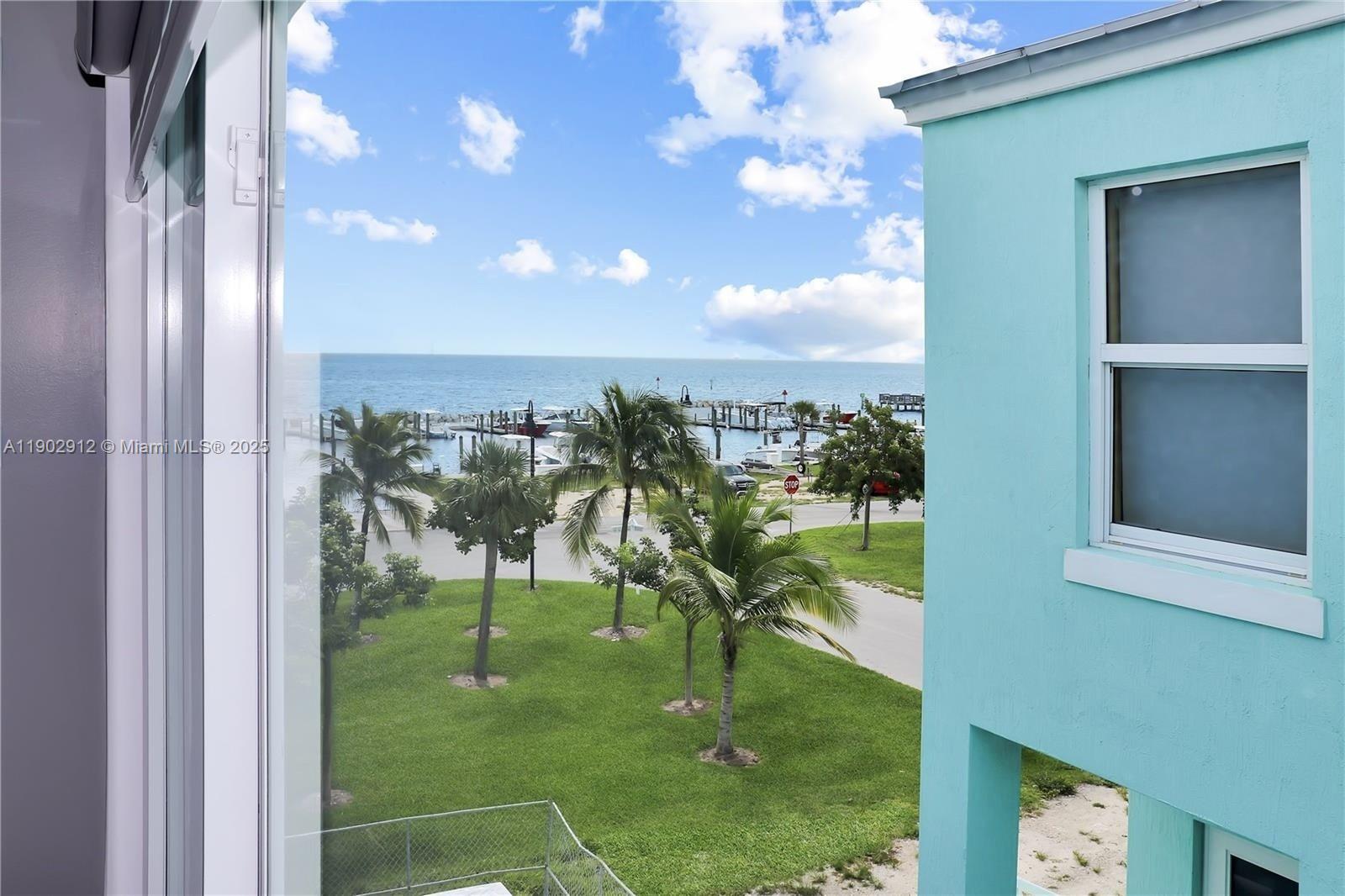 94825 Overseas Highway, Unit 172 Key Largo, FL 33037 - Photo 21 of 40 a view of swimming pool from a balcony