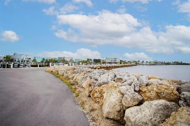 a view of balcony with wooden floor and city view
