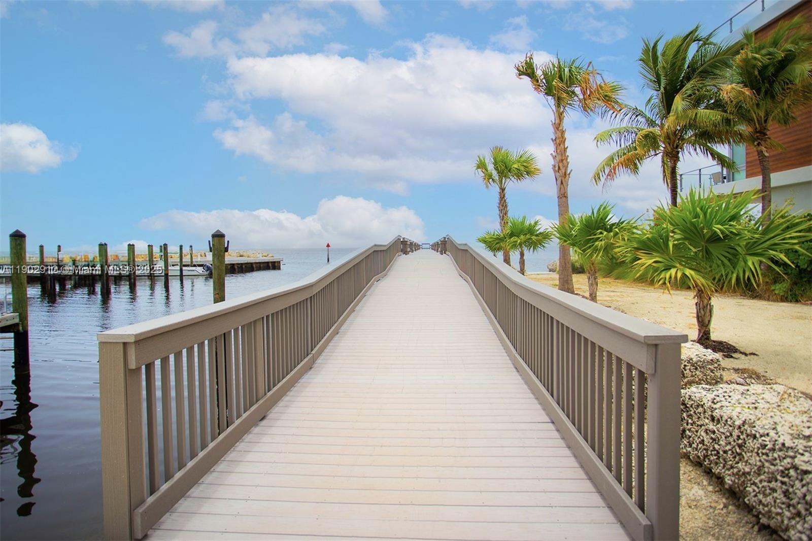 94825 Overseas Highway, Unit 172 Key Largo, FL 33037 - Photo 36 of 40 a view of balcony with wooden floor and city view