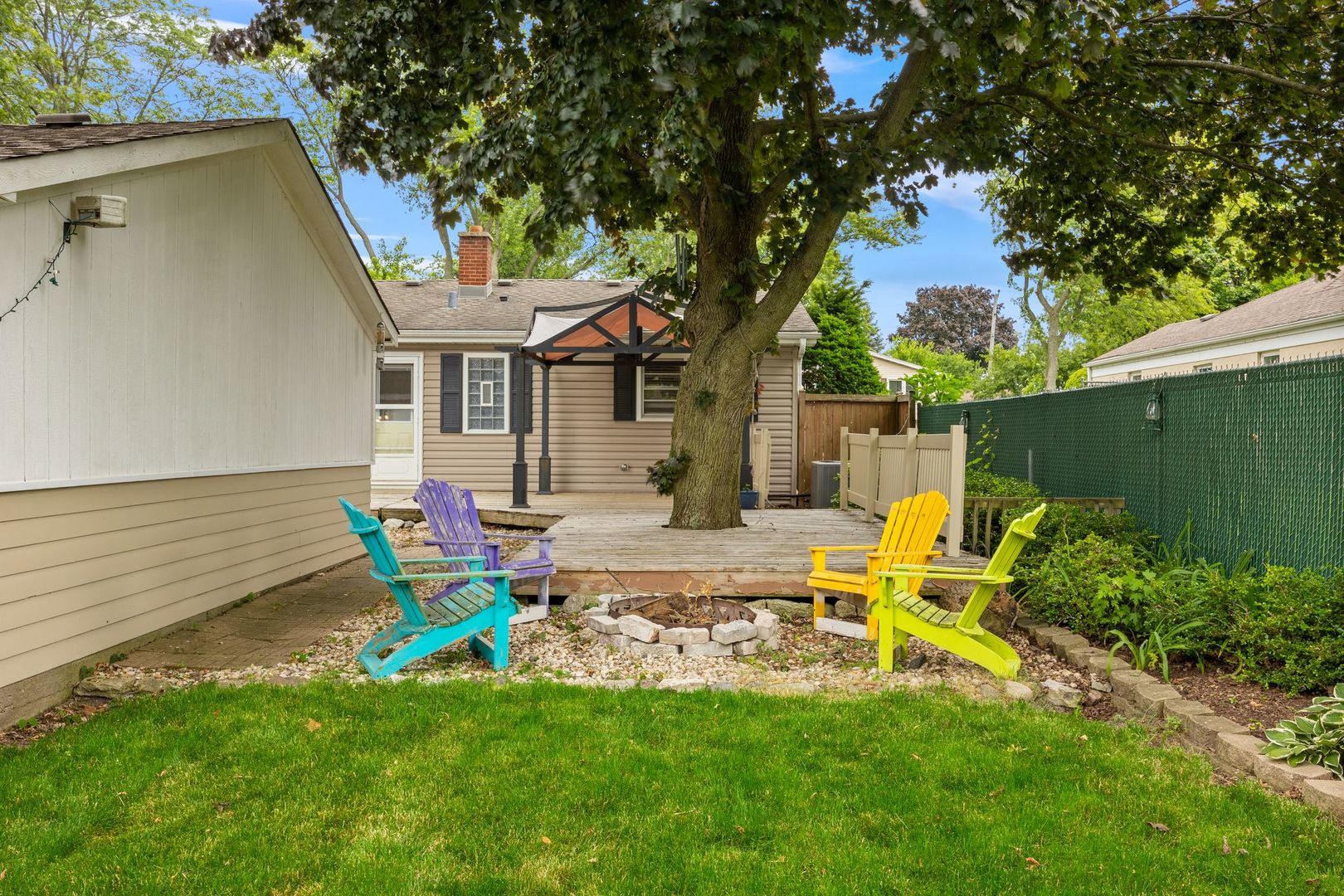 149 Wheeling Avenue Wheeling, IL 60090 - Photo 19 of 23 a front view of a house with garden and sitting area