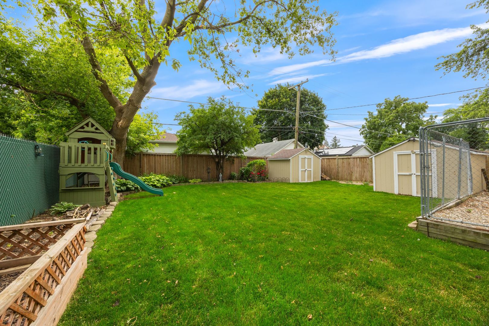 149 Wheeling Avenue Wheeling, IL 60090 - Photo 20 of 23 a view of a house with backyard and a tree