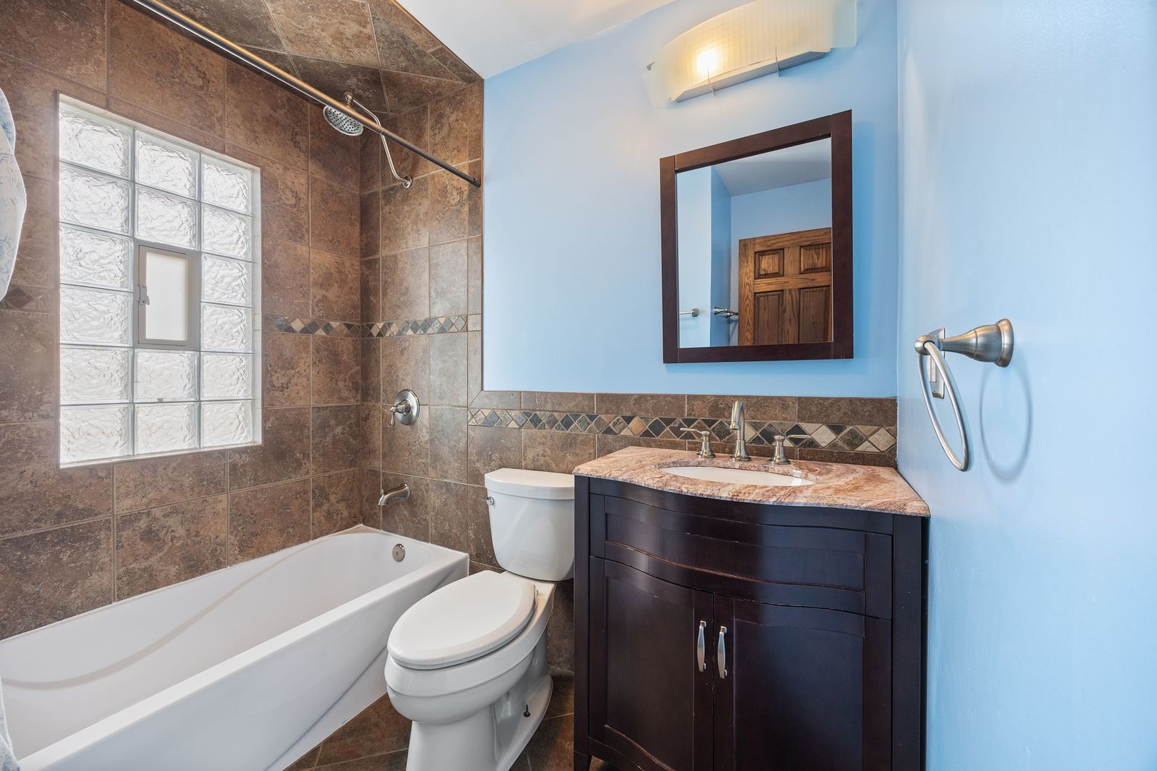 149 Wheeling Avenue Wheeling, IL 60090 - Photo 9 of 23 a bathroom with a sink toilet and shower
